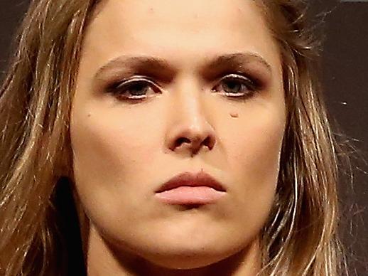 RIO DE JANEIRO, BRAZIL - JULY 31: UFC Strawweight Champion Ronda Rousey of the United States poses for photographers during the UFC 190 Rousey v Correia weigh-in at HSBC Arena on July 31, 2015 in Rio de Janeiro, Brazil. (Photo by Matthew Stockman/Getty Images)