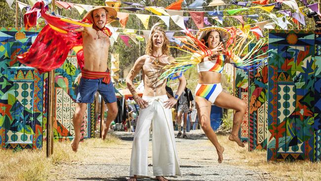 Hamish Doncaster from Byron Bay, Lucas Vignaud from France and Nica Cor from Brazil, get into the spirit at a pervious Woodford Folk Festival. Picture: Lachie Millard