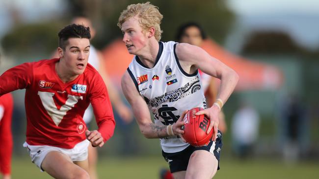 South Adelaide’s Mark Noble takes on North Adelaide’s Connor Rozee. Picture: AAP Image/Dean Martin.