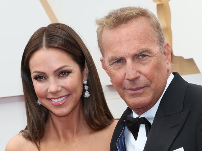 HOLLYWOOD, CALIFORNIA - MARCH 27: (L-R) Christine Baumgartner and Kevin Costner attend the 94th Annual Academy Awards at Hollywood and Highland on March 27, 2022 in Hollywood, California. (Photo by David Livingston/Getty Images)