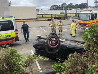 Shocking moment vehicle lands upside down in car park