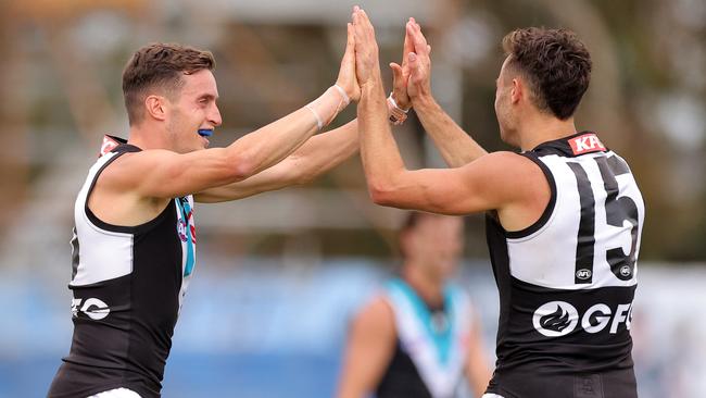 Karl Amon celebrates a Power goal with Orazio Fantasia (left).