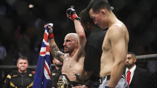 Volkanovski raises his arms after defending his UFC featherweight title against Chan Sung Jung at UFC 273 in April. Picture: James Gilbert/Getty Images