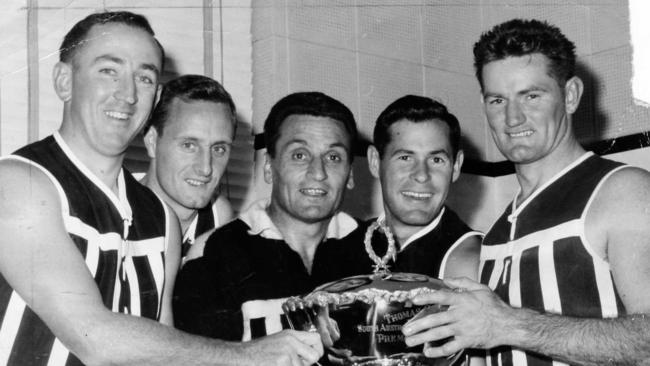 From left: Neville Hayes (playing in his twelfth year after 94 games); Peter Obst (tenth year, 140 games); coach Fos Williams (fourteenth year, 206 games, including matches played with West Adelaide); Bob Fabian (tenth year, 104 games); and Geof Motley (twelfth year, 202 games). Used 11 Apr 1964.