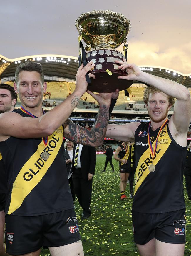 Glenelg players Jesse White and Josh Scott after the Tigers broke their premiership drought in this year’s SANFL grand final. Picture SARAH REED