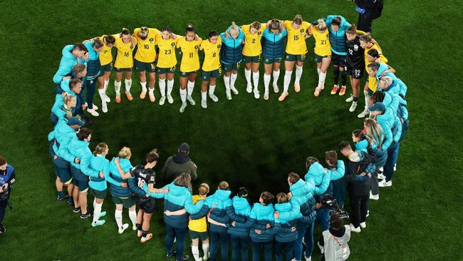 Australia players huddle after the team's 1-3 defeat and elimination from the tournament. (Photo by Robert Cianflone/Getty Images )