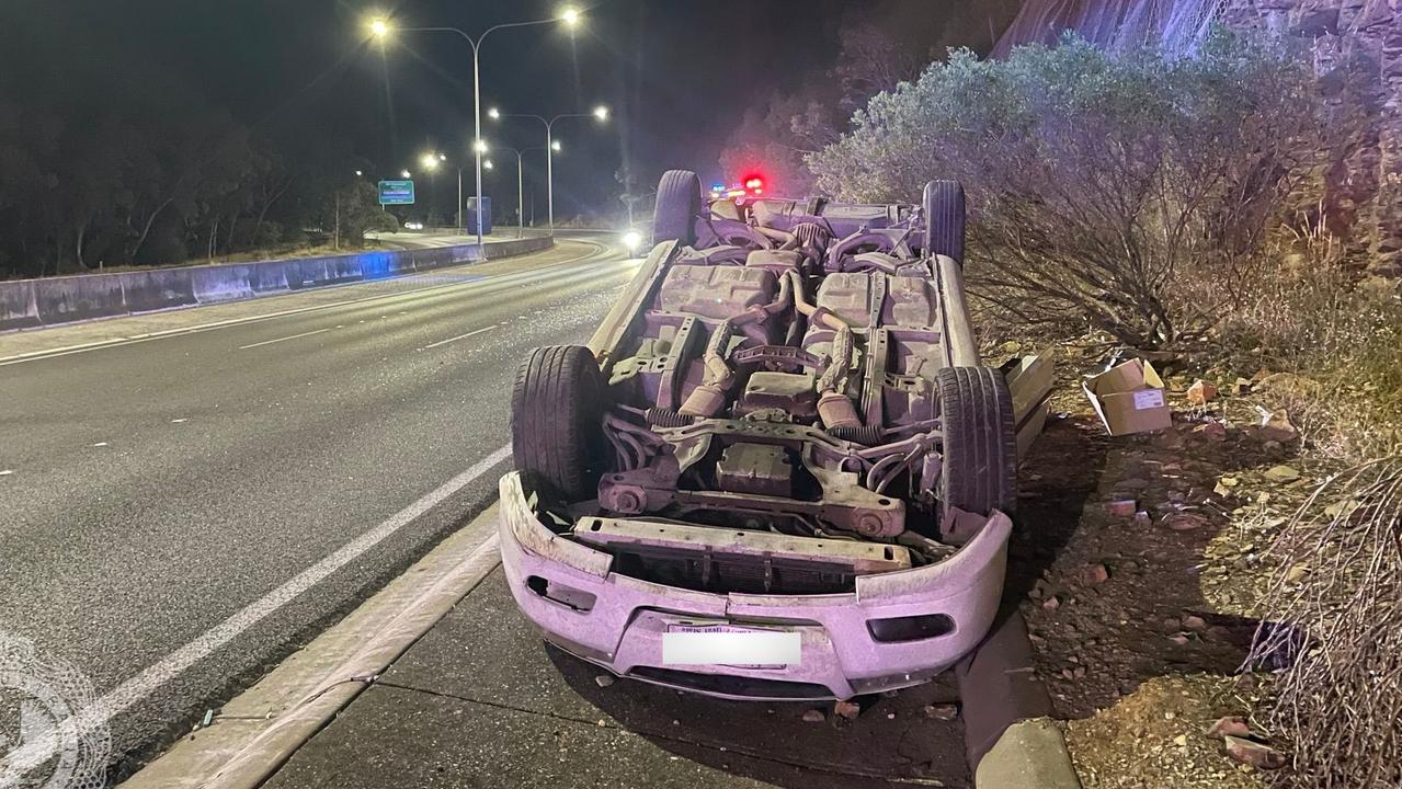 The white Holden sedan rolled on the Freeway on Monday evening. Picture: SA Police