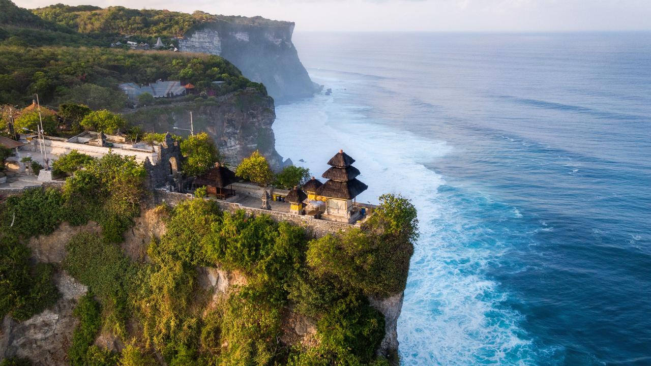 Uluwatu Temple in Bali is known for its mischievous long-tailed monkeys. Picture: iStock