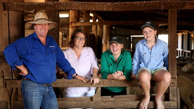 Steve and Carol Huggins, Woodpark Poll Merinos, Hay. pictured with their daughters, Isobel and Olivia. Picture: Andy Rogers