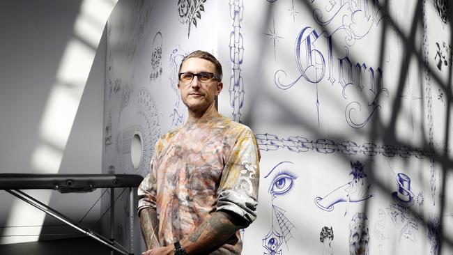 Scott Campbell, US provocateur tattooist to the stars at his ‘Whole Glory’ installation in Sydney. Campbell’s free blind-tattooing is a part of the Festival of Dangerous Ideas, held at the Carriageworks in Eveleigh. Picture: Jonathan Ng