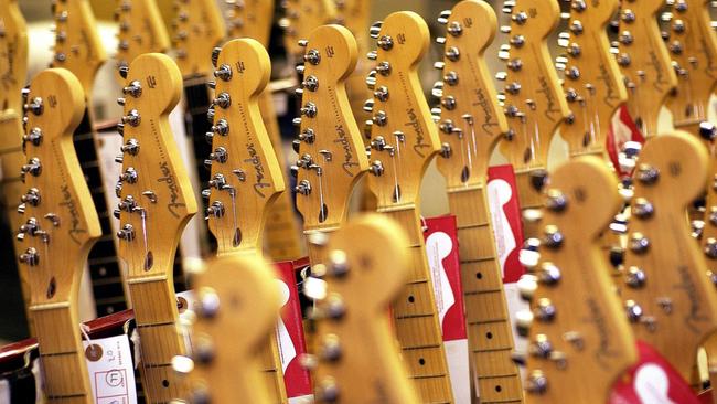 Rows of new Fender Stratocaster guitars await shipment at the Fender factory in Corona, California in 2003. Picture: archive