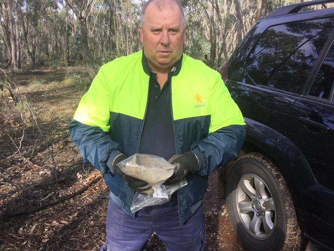 Daryl Floyd, the brother of missing murdered schoolboy Terry Floyd, 12, with a shoe he has found down the old gold mine he believes Terry's body was dumped down in 1975.