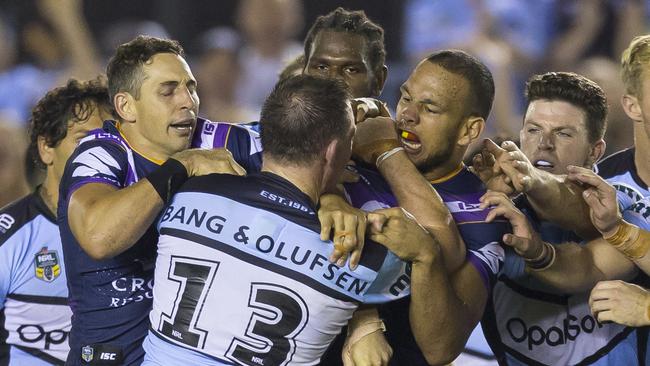 William Chambers of the Storm and Paul Gallen of the Sharks rumble at the end of the Round 4 NRL match between the Cronulla-Sutherland Sharks and the Melbourne Storm at Southern Cross Group Stadium in Sydney, Friday, March 30, 2018. (AAP Image/Craig Golding) NO ARCHIVING, EDITORIAL USE ONLY