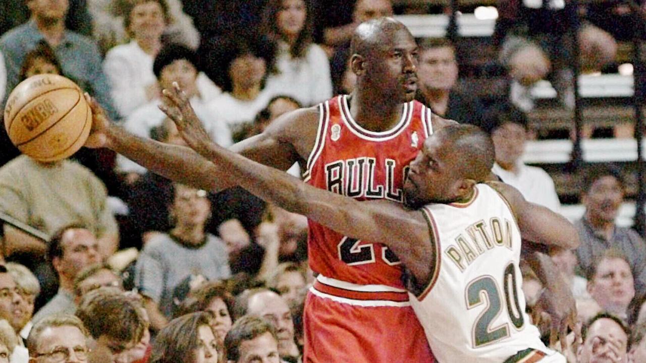 Michael Jordan holds ball away from Gary Payton during Game 4 of the 1996 NBA Finals.