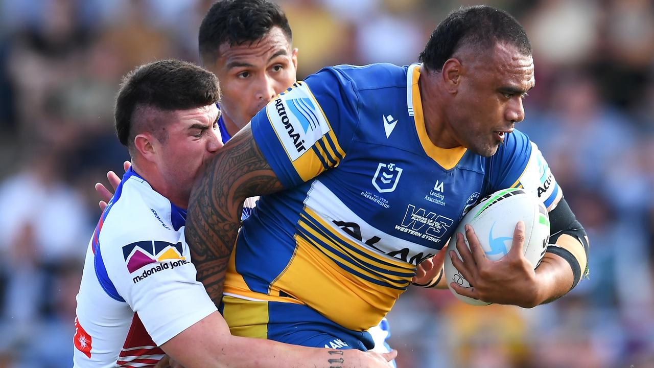 ROCKHAMPTON, AUSTRALIA - SEPTEMBER 12: Junior Paulo of the Eels is tackled by Bradman Best of the Knights during the NRL Elimination Final match between Parramatta Eels and Newcastle Knights at Browne Park, on September 12, 2021, in Rockhampton, Australia. (Photo by Albert Perez/Getty Images)