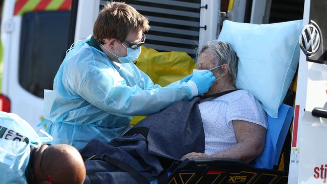 A resident is taken from the Epping Gardens aged care facility. Picture: Getty Images