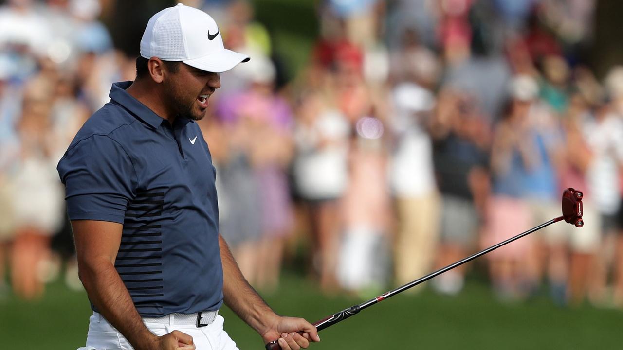 Jason Day reacts following his par putt on the 18th green.