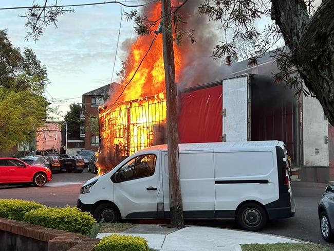 Residents nearby watched as the delivery truck caught on fire after bringing down power lines. Picture: Facebook