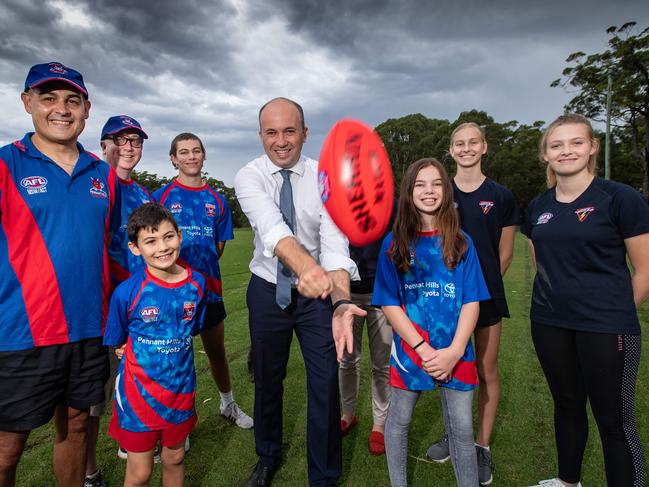 The funding follows the state government’s commitment of $965,000 for the project. State liberal member for Hornsby Matt Kean pictured with representatives of the Demons. Picture: Julian Andrews.