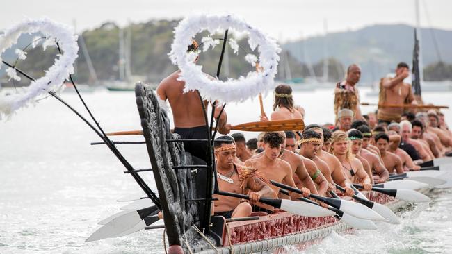 Traditional waka paddle down the Waitangi River on Waitangi Day. Picture: AAP.