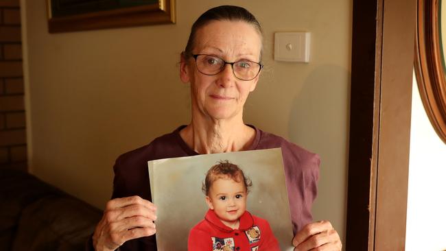 Kirsty Rosse-Emile’s mother Emma holds a photo of her daughter as an infant. Picture: Stuart McEvoy