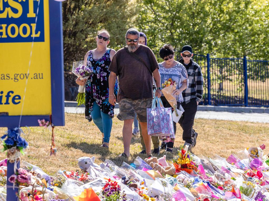 The father of Peter Dodt, Andrew, alongside family as he pays tribute to the children who died at Hillcrest Primary School in Devonport Tasmania. Picture: Jason Edwards