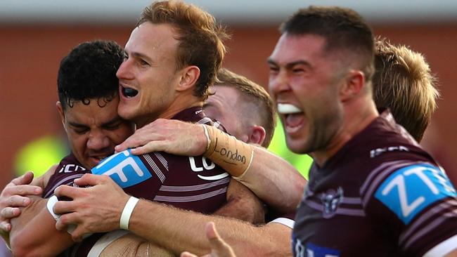 Daly Cherry-Evans of the Sea Eagles celebrates with teammates after kicking the winning field goal in extra-time against the Canberra Raiders at Lottoland.