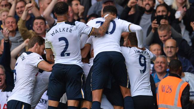 Tottenham players celebrate with Victor Wanyama.