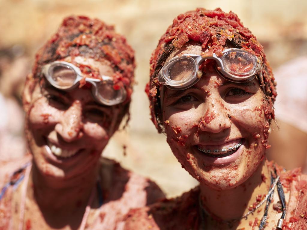 More drip than dip: festival goers wore swimming goggles for protection against the onslaught of ripe tomatoes. Picture: Manuel Queimadelos Alonso/Getty Images