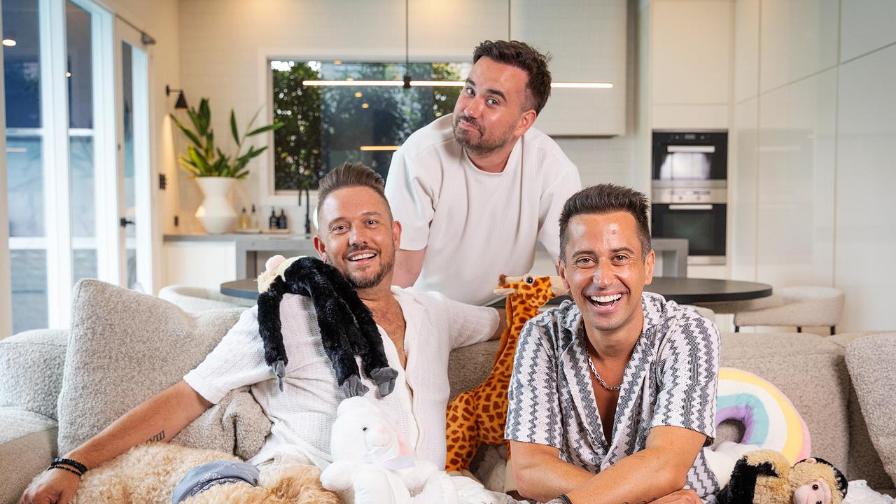 Luke (M) and Scott (R) have a huge following through the Luke and Sassy Scott Podcast where they discussed the surrogacy with Marcus (L) a three-part series. Picture: Mark Stewart