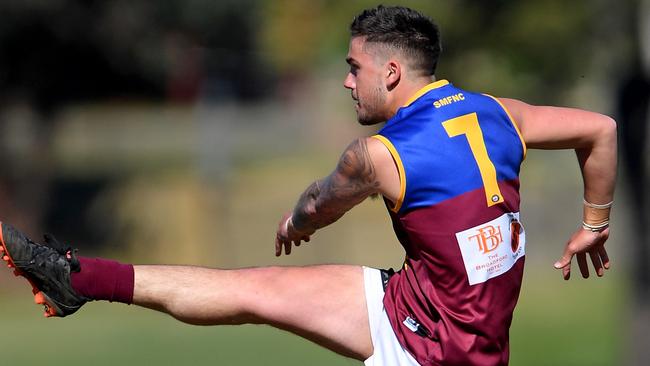 Ben Muscat launches a long ball for South Morang. Picture: Andy Brownbill