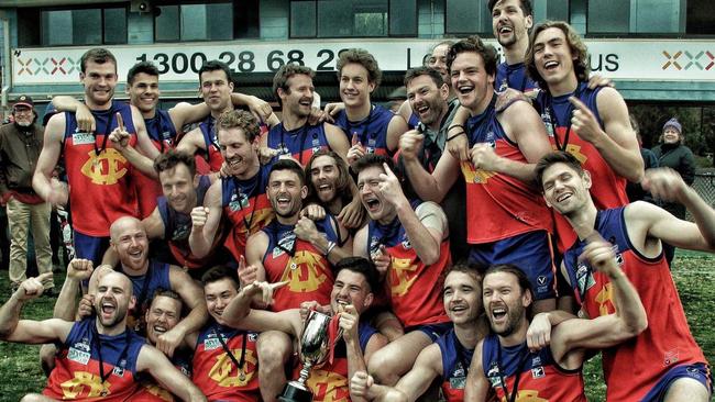 Fitzroy players enjoy the spoils of their historic premiership win. Picture: Phyllis Quealy