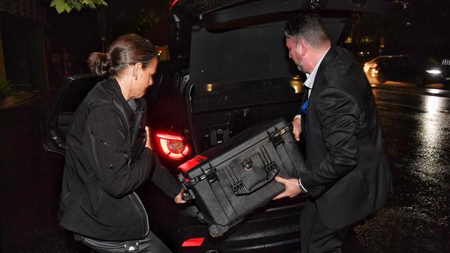 Australian Federal Police with a box of documents leave AWU offices on Spencer Street, Melbourne. Picture: Jason Edwards.