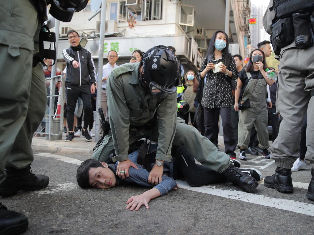 A protester is detained in Hong Kong. Picture: Kin Cheung/AP