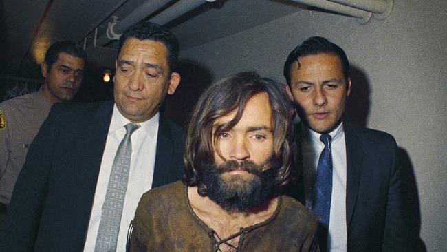 Charles Manson is escorted to his arraignment on conspiracy-murder charges in connection with the Sharon Tate murder case. Picture: AP