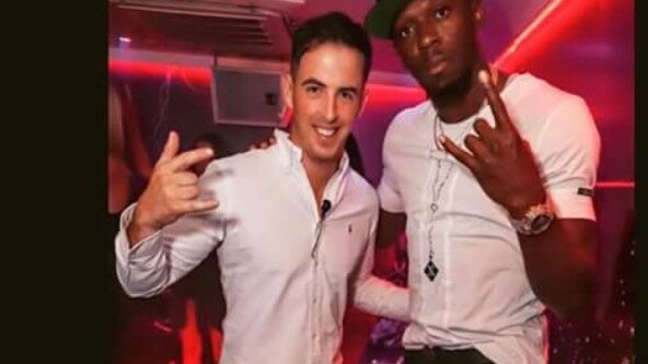 Sin City VIP host Ric Gibson with Usain Bolt in the Surfers Paradise nightclub during the Commonwealth Games - Bolt went in and let his hair down at the venue just about every single night he was on the Gold Coast.