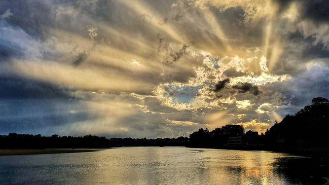 Sun bursting through the clouds at Nambucca Heads snapped by Bronwyn Hawkes.