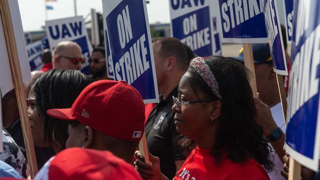 UAW members and workers at the Mopar Parts Center Line in Michigan rally after walking off their jobs. Picture: AFP.