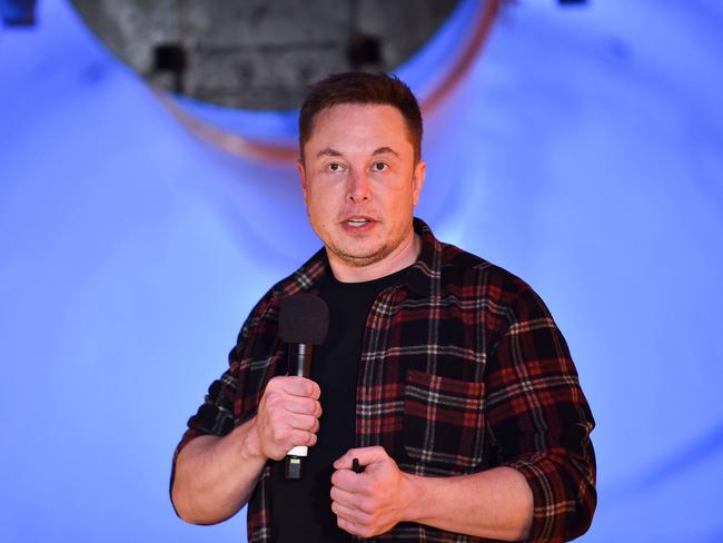Elon Musk, co-founder and chief executive officer of Tesla Inc., speaks during an unveiling event for the Boring Company Hawthorne test tunnel in Hawthorne, south of Los Angeles, California on December 18, 2018. - Musk explained that the snail moves 14 times faster than a tunnel-digging machine.  On Tuesday night December 18, 2018, Boring Co. officially opened the Hawthorne tunnel, a preview of Elon Musk's larger vision to ease L.A. traffic. (Photo by Robyn Beck / POOL / AFP)
