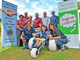 Launching the new beach wheelchair are (front) Ashton, his mum Angela Mathew of Lifestyle Solutions and Elisha Hillier from Goonellabah Sports & Aquatic Centre with (rear l-r) Lismore City Lions Club members Nancy Casson, Rod Johnston, Lola Reichelt and Sandy McLean, DAISI Executive Officer Brett Carn and Lismore's Deputy Mayor Gianpiero Battista.