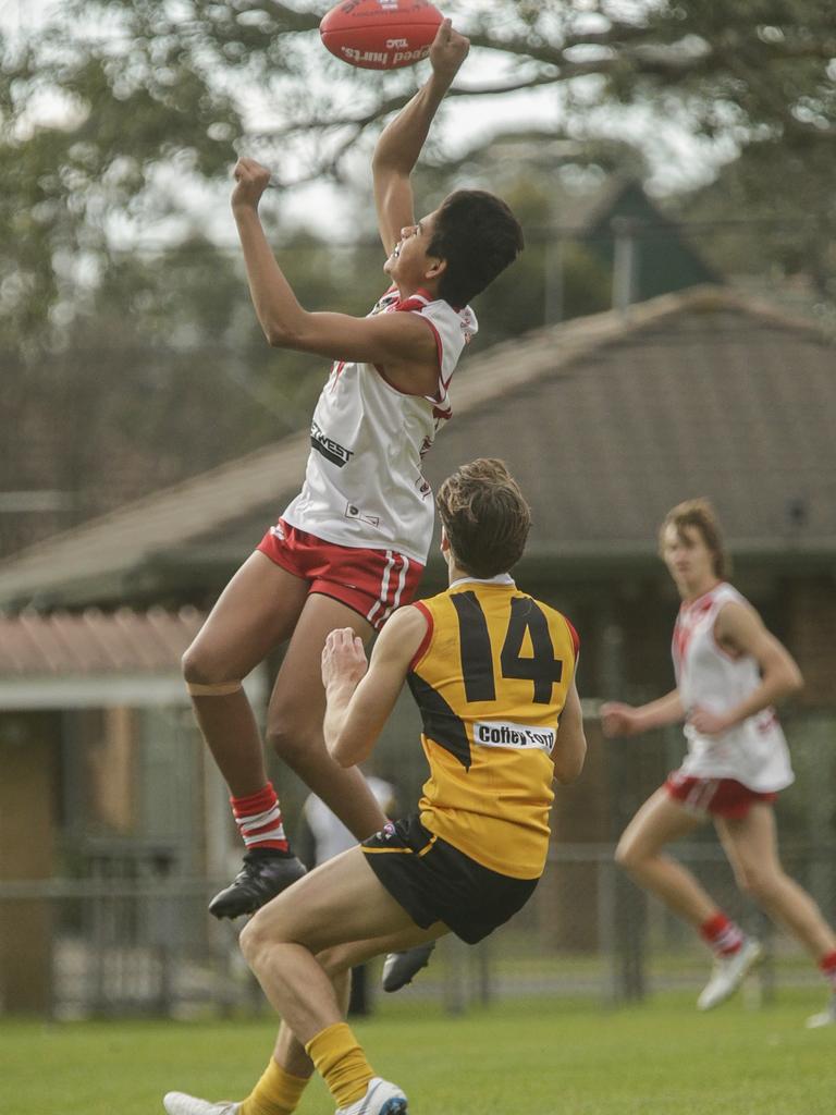 Izayah Rioli flies for a mark. Picture: Valeriu Campan