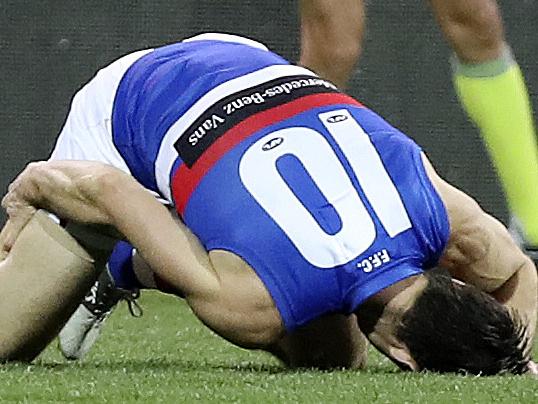 14/06/18 - AFL - Port Adelaide v Western Bulldogs at The Adelaide Oval. Easton Wood goes down with a hamstring. Picture SARAH REED