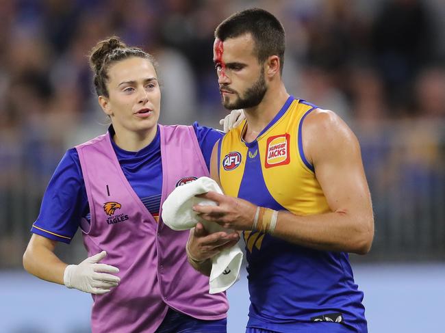 Josh Rotham leaves the field under the blood rule. (Photo by Will Russell/AFL Photos via Getty Images)