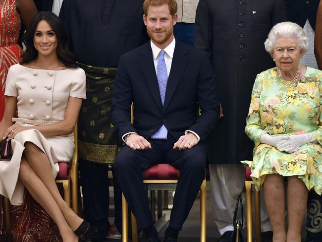 Britain's Queen Elizabeth, Prince Harry and Meghan, Duchess of Sussex. Picture: AP