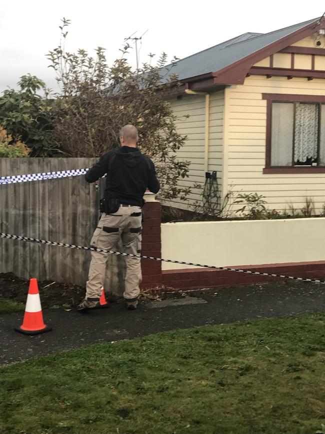 Tasmania Police crime scene investigators and officers on Main Street in Ulverstone where a woman was found dead. Photo: Helen Kempton