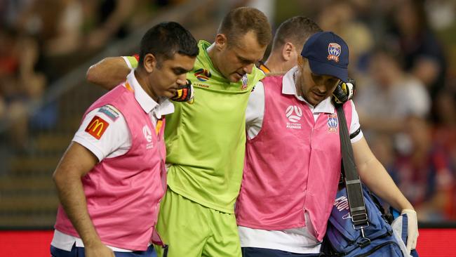 Glenn Moss goes off injured during the Jets game with Sydney FC earlier this month.