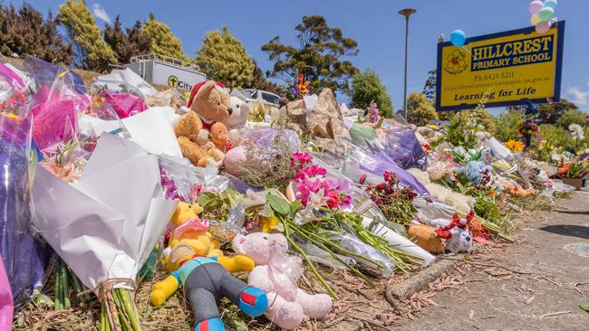 Mourners laid floral tributes and toys for the children. Picture: Jason Edwards