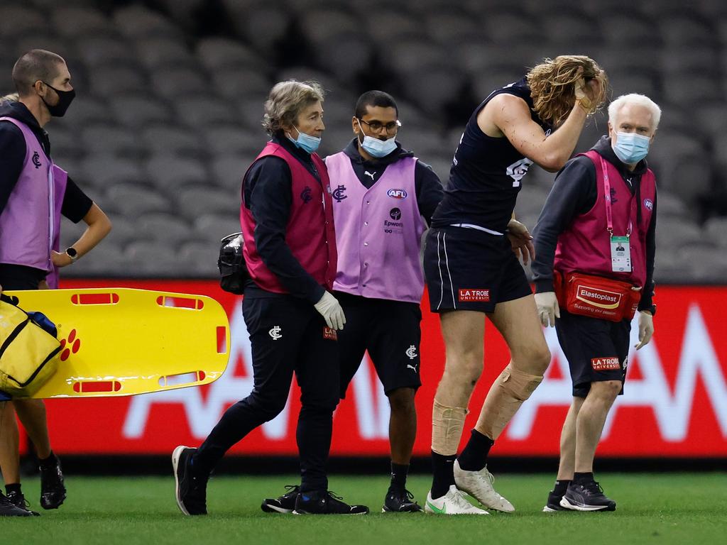 The Blues youngster tried to shrug off the trainers. (Photo by Michael Willson/AFL Photos via Getty Images)