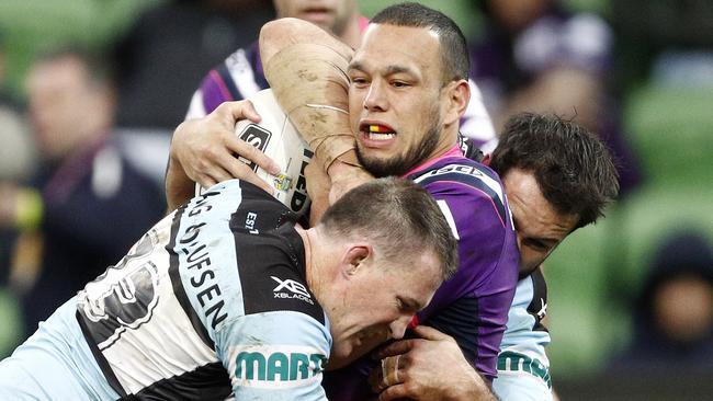 Will Chambers of the Storm (right) is tackled by Paul Gallen of the Sharks (left) during the Round 22 NRL match between the Melbourne Storm and the Cronulla-Sutherland Sharks at AAMI Park in Melbourne, Sunday, August 12, 2018. (AAP Image/Daniel Pockett) NO ARCHIVING, EDITORIAL USE ONLY