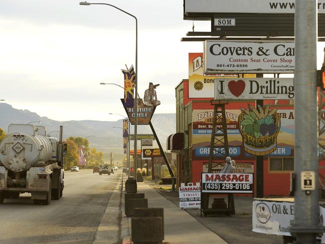 Oil and gas trucks that roll through Vernal spew smog into air already polluted by emissions from 11,200 wells in the Uintah Basin.